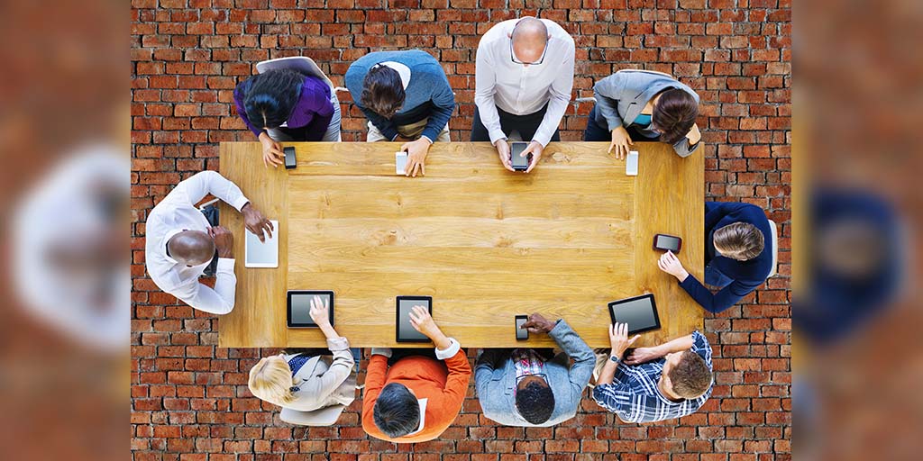 group of people accessing their mobile devices |How mLearning is Changing The eLearning Landscape